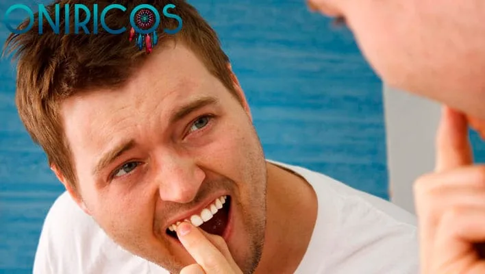 dreaming about your teeth falling out and spitting them out - oneiromancy